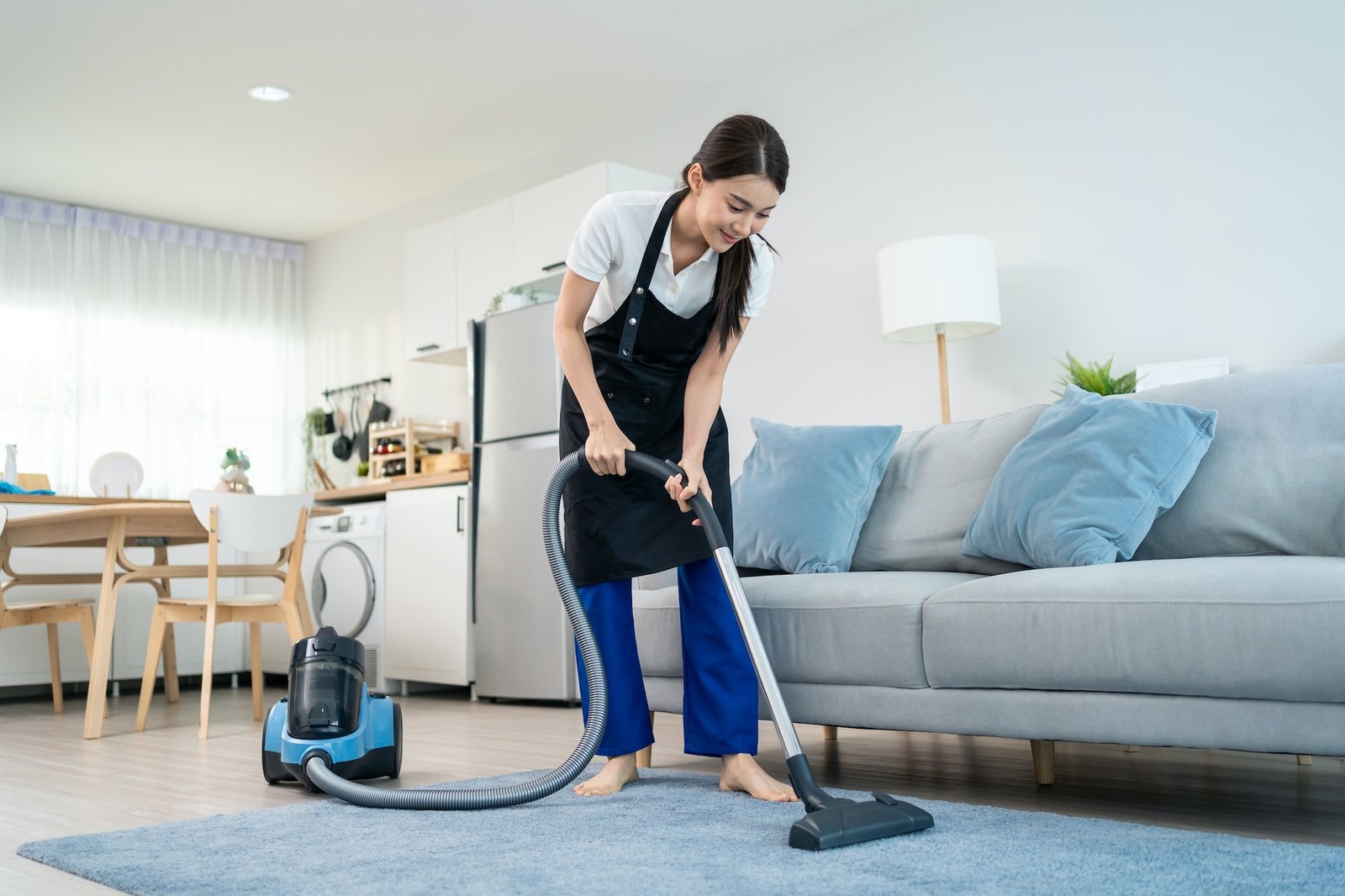 asian-cleaning-service-woman-worker-cleaning-in-living-room-at-home-.jpg